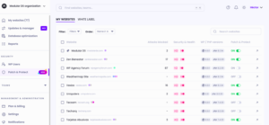 New Patch & Protect dashboard in Modular DS showing the “My Websites” list view with multiple WordPress sites, including columns for attacks blocked, security and health alerts, WordPress and PHP versions, and Patch & Protect status toggles (ON/OFF), along with filters, search bar, and left sidebar navigation.