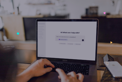 Person typing on a laptop with an AI assistant chat open, asking “Which of my sites have known vulnerabilities?” with Modular DS MCP connected and suggestions for pending updates, security issues, and uptime status.